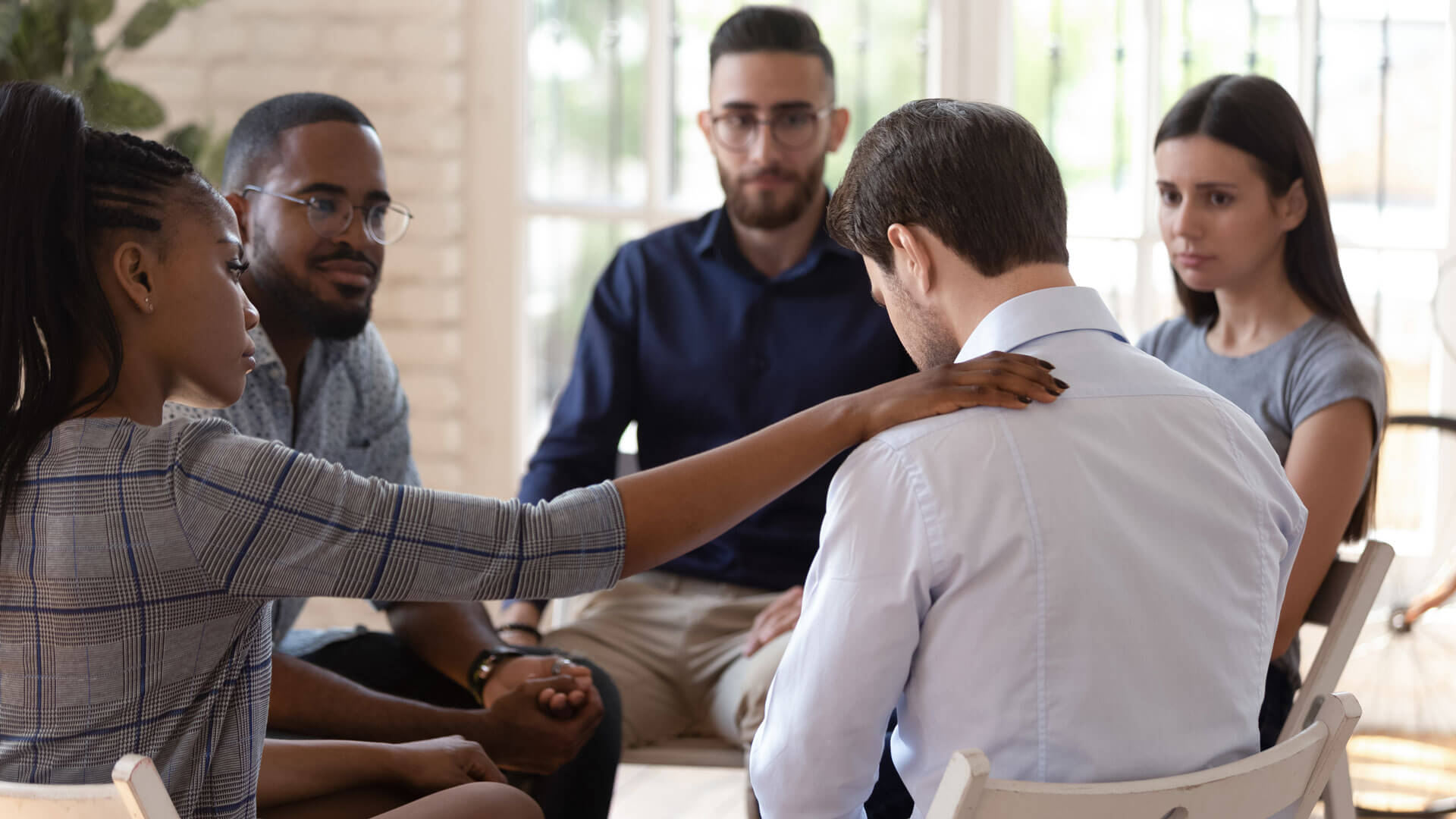 Support group consoling a member
